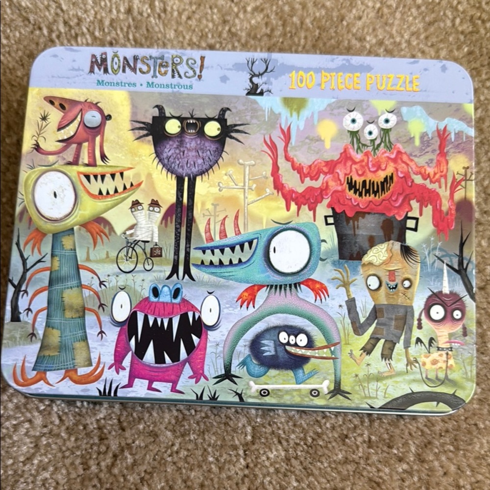 Colorful Monster Puzzle Game with Whimsical Designs in metal tin-all pieces!